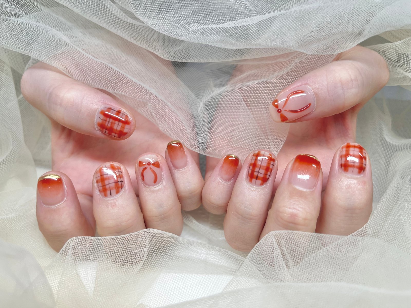 NICENAILのお客様施術 オレンジ系のチェック＆フレンチネイル