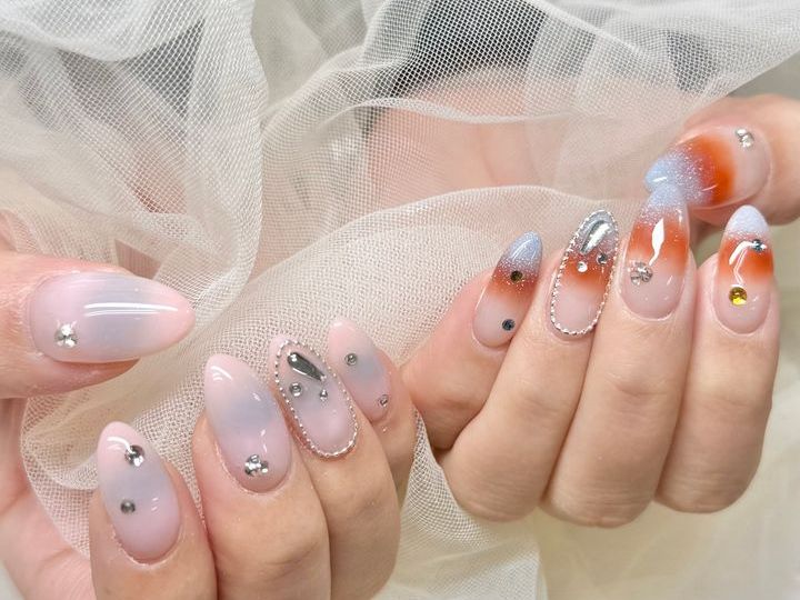 NICENAILのお客様施術 ピンク×オレンジグラデーションストーン
